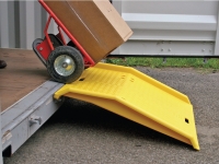 eagle polyurethane dock plate in use with dolly carrying boxes