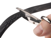 Clean Cut PET braided sleeving being cut with scissors