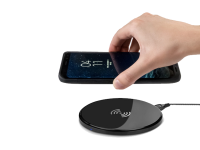 Black ultra slim qi wireless charging pad in use