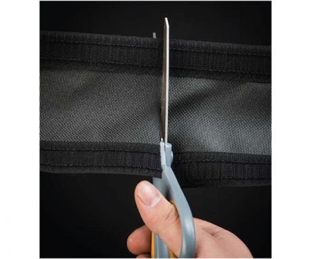 Durarace cord cover being cut with scissors