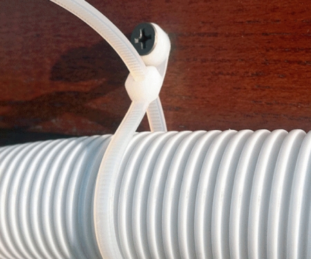 Natural mounted head tie used for securing wire loom